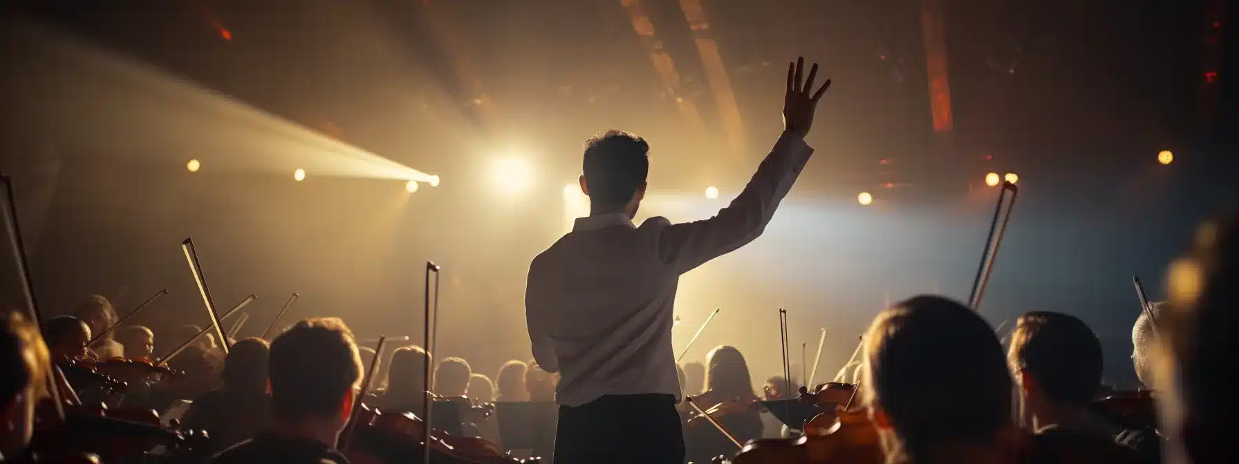 A Symphony Conductor Guiding A Harmonious Orchestra Performance.