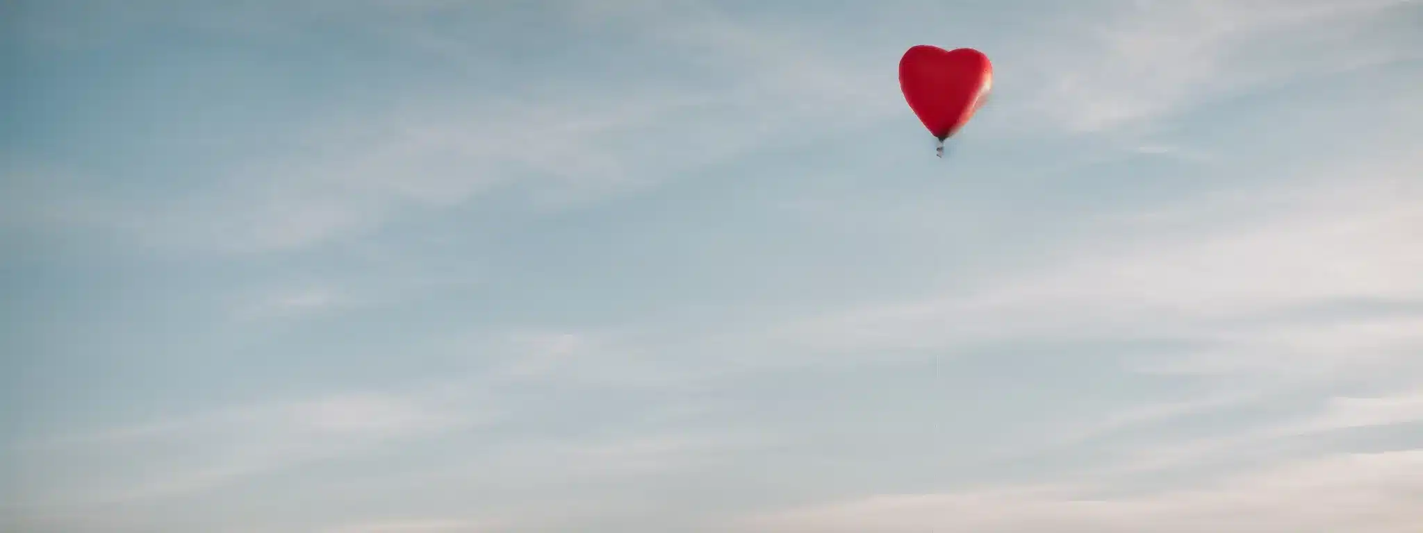 A Heart-Shaped Balloon Gently Floating Against A Serene Sky, Symbolizing The Lasting Emotional Connection Between Brand And Consumer.