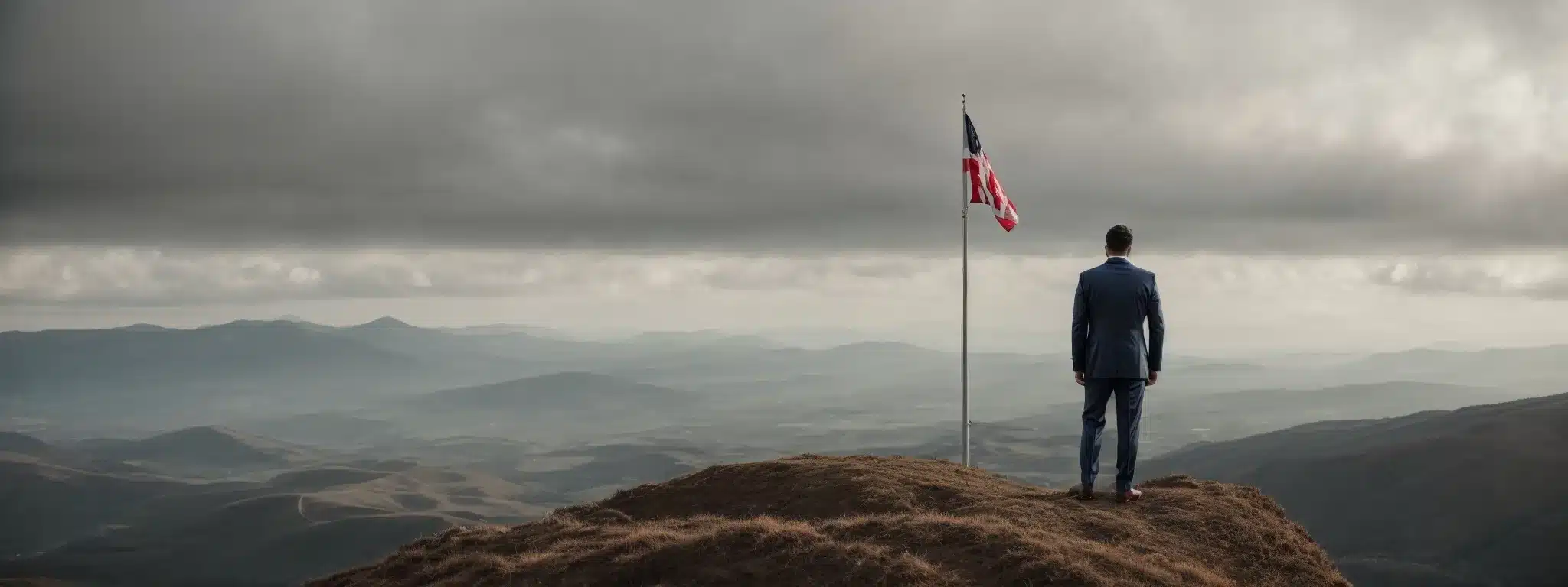 A Businessman Standing On Top Of A Mountain With A Flag, Gazing Out Over A Vast Landscape, Symbolizing Conquest And Strategy In Customer Engagement.