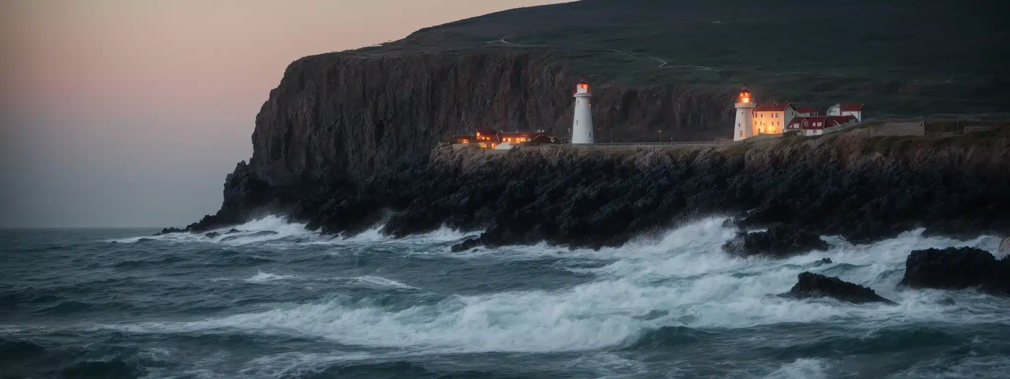 A Gleaming Lighthouse Towers Above The Rocky Coast, Its Light Piercing Through The Twilight To Guide Ships Safely Home.