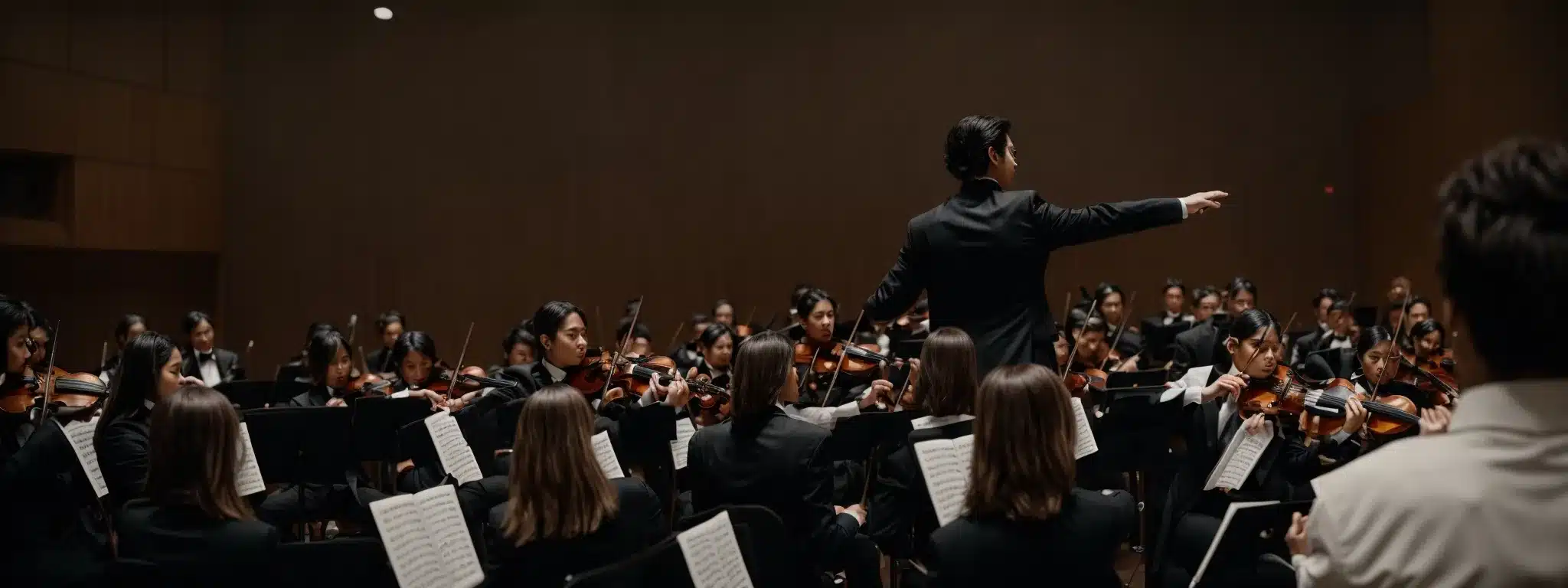 A Conductor Leading An Orchestra, Symbolizing Strategic Leadership In Marketing Engagement.