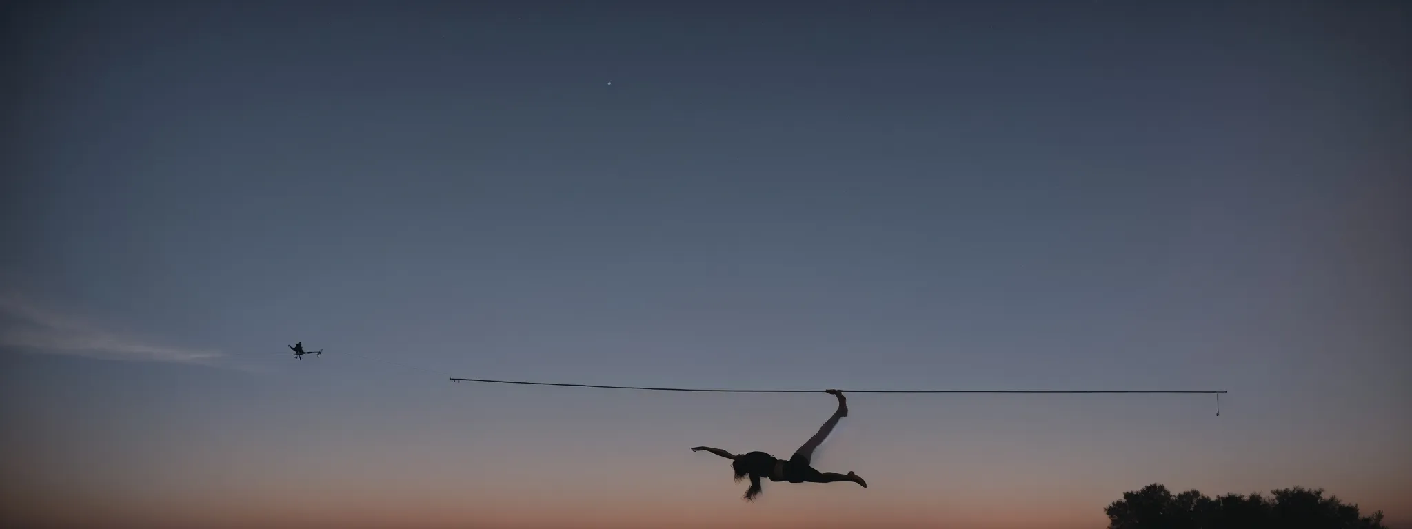 A Silhouetted Acrobat Balancing On A Wire Against A Twilight Sky, Symbolizing The Delicate Data Migration Process.