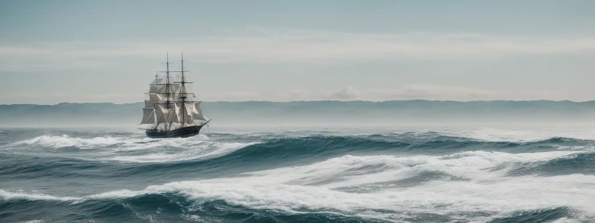 A Tall Ship Bravely Navigating Through A Serene, Vast Ocean Under A Clear Sky.